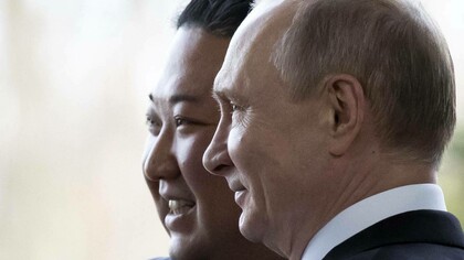 Russia's President Vladimir Putin posing for a photo-op with the Supreme Leader of North Korea Kim Jong-Un