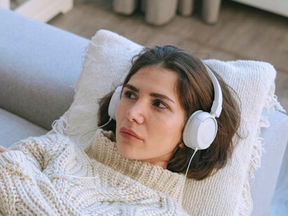 Wrapped in the embrace of her favourite music, she transforms her pain into an expressive journey of self-discovery