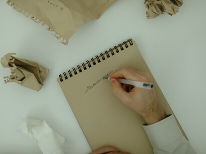 A man scrapping his mistake on a page with a pen, learning from his mistake