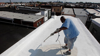 Painting a New York City rooftop with reflective paint fights heat