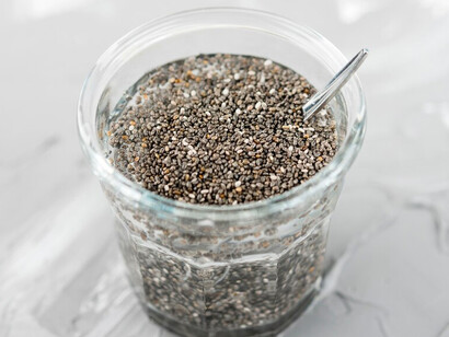 A jar of chia seeds, highlighting the role of ancient superfoods in sustainable agriculture and traditional diets
