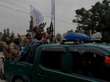 Taliban fighters patrol in a captured Humvee in the days following Kabul’s collapse in August 2021