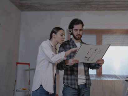 Focused city planners review urban development strategies, aiming to enhance living conditions and social justice in line with the principles set forth in the Vancouver Declaration on Human Settlements