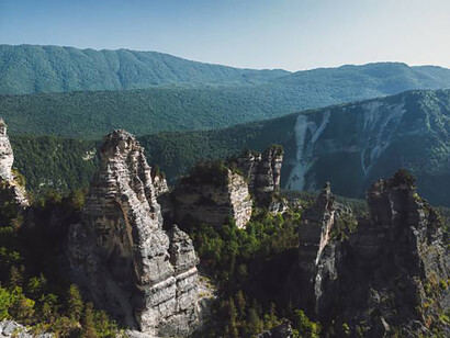 Sunset aerial view of the Sairme pillars and surrounding rock massifs in Georgia’s Caucasus region
