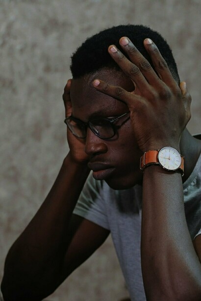 Man lowering his gaze in confusion and frustration