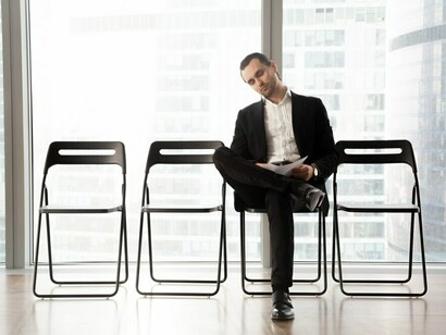 An expat preparing for a job interview, navigating the challenges of settling into a new country and career