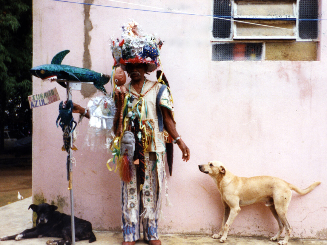 Photo by Dimitri Ganzelevich, Raimundo Borges Falcão (dates unknown) in his carnival disguise at Carnival Fantasia “Blue Shark”, Near Salvador, Bahia, Brazil, 2000, Color photograph, 7 x 5", Courtesy Beate Echols