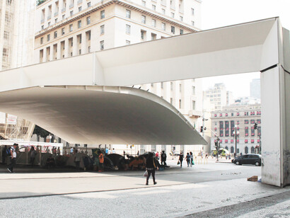 The cantilevered steel design at São Paulo’s Patriarch Plaza serves as both a functional shelter and a striking architectural feature, guiding visitors from the bustling city square to the underground mass transit system, as part of the area's revitalization between 1992 and 2002