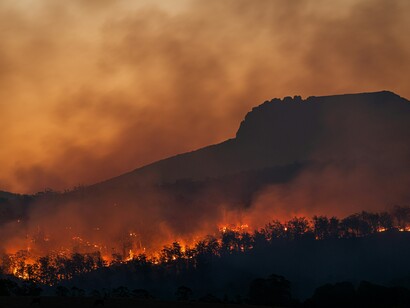 Bushfires spread across the landscape below Stacks Bluff, Tasmania, Australia