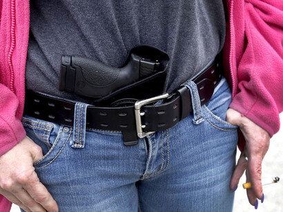 Person carrying a gun 