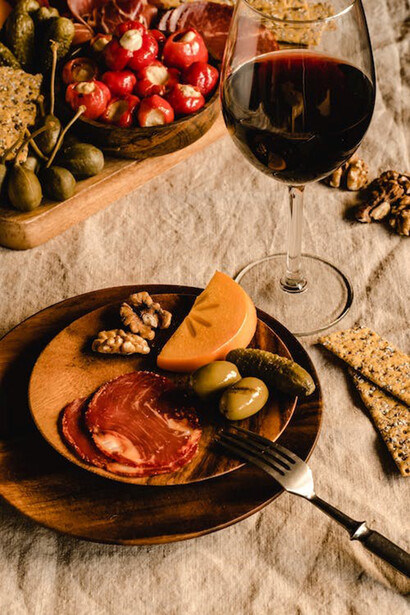 Snacks lined up with wine and sourdough bread