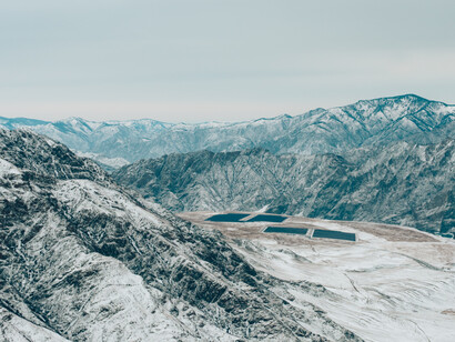 Solar panels in the snow-covered mountain tops