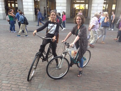 The two friends riding their bikes in Covent Garden, London