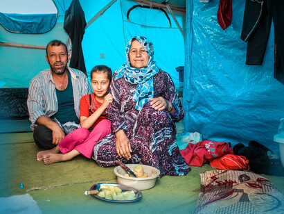 An Iranian mother, father, and one of her daughters in the tent of an Iranian Refugee camp, in Samawah, Iraq
