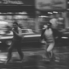 Ann Treer, Untitled (Two Boys Running in the Street), 1963, vintage silver print mounted to board, 9x13.25 inches, © The Estate of Ann Treer. Courtesy Robert Mann Gallery
