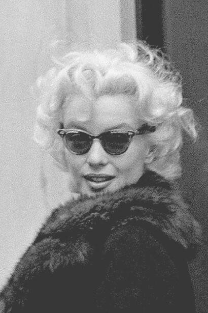 Marilyn Monroe wearing cat-eye sunglasses