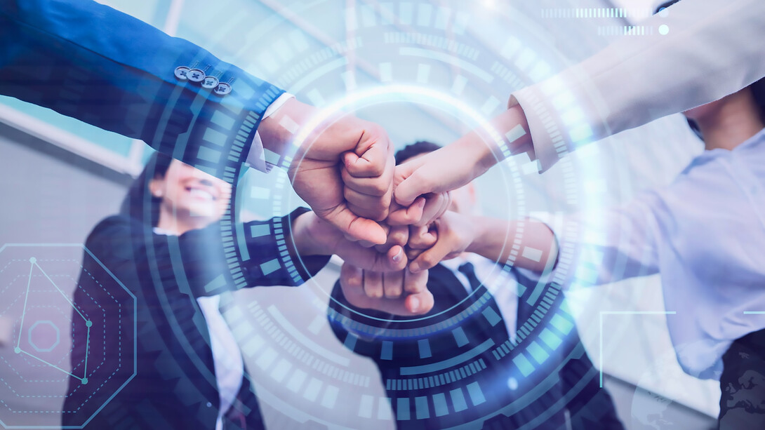 A diverse team engaged in brainstorming sessions, fostering innovation through collaborative research, development, and creative entrepreneurship, fueled by funding and technological advancements in a dynamic lab environment