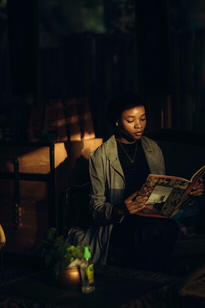 A person sat alone reading 