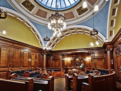 Elegant empty Victorian council chamber with a skylight, Lancaster, England, United Kingdom