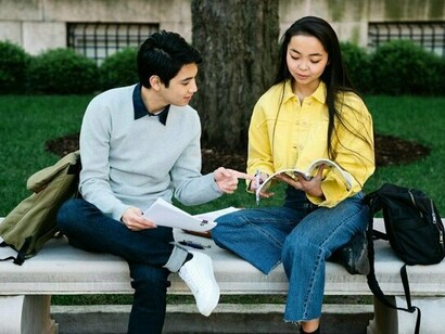Two students focused on their studies, highlighting the resilience and determination of Ormocanon youth