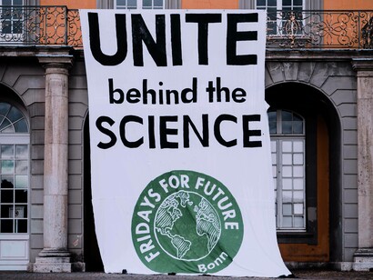 A banner urging people to follow science, Bonn, Germany, 2021