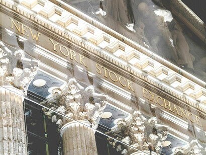 Ultimately, the text asserts that true universal well-being can only be achieved by replacing competitive sovereign nation-states with a democratic world government structured under the Constitution for the Federation of Earth. New York Stock Exchange Broad Street facade
