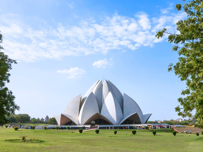 The Lotus Temple is designed to look like a partially opened lotus flower, with 27 marble-clad petals curved to form nine entrances