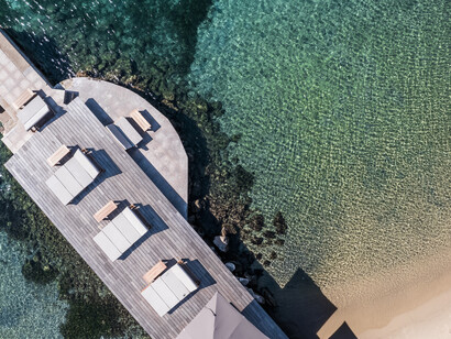 Immerse yourself in the unparalleled beauty of Sardinia with a stunning bird's eye view from Delphina Hotels' prime locations, Italy