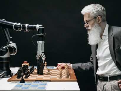 Man playing chess with artificial intelligence 