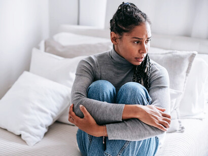 In the quietude of her solitude, the woman confronts the daunting emptiness of boredom, surrendering to the disquieting tranquility of simply being