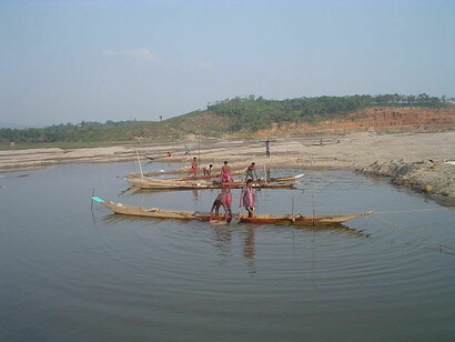 People on boats in Jaflong in the Division of Sylhet, Bangladesh. It is situated at the border between Bangladesh and the Indian state of Meghalaya. Jaflong is famous for being the home of the Khasi tribe