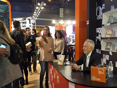 J. M. Coetzee meets readers and signs copies of his works at the Penguin Random House Grupo Editorial stand at the Buenos Aires Book Fair, Argentina