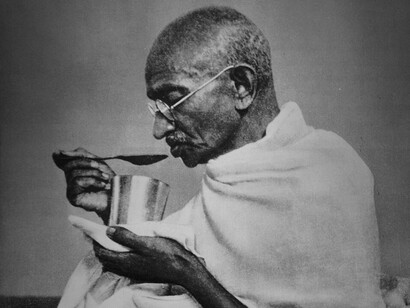 Indian leader Mahatma Gandhi eating