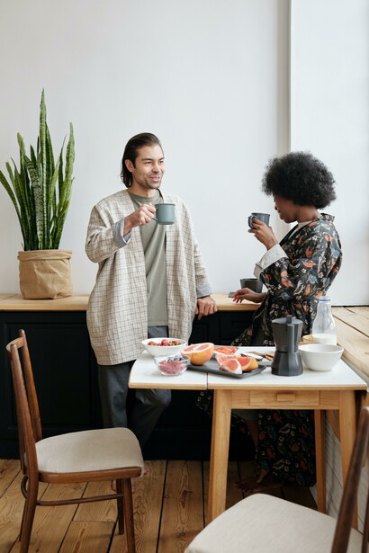 Two people taking a break to drink coffee 