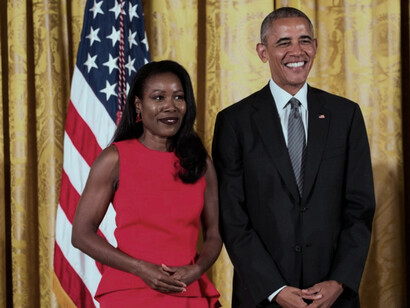 Isabel Wilkerson, the author, standing with then-President, Barak Obama