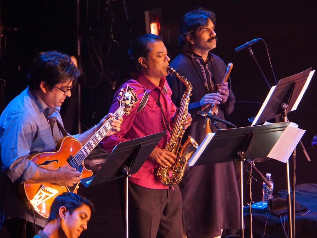 The Song of the Jasmine; Rajna Swaminathan (mridangam), Rez Abbasi (guitar), Rudresh Mahanthappa (saxophone)  V. K. Raman (South Indian flute); Photo: Praba Manivasagar.