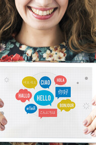 "Hello" in different languages in bubbles on an ipad