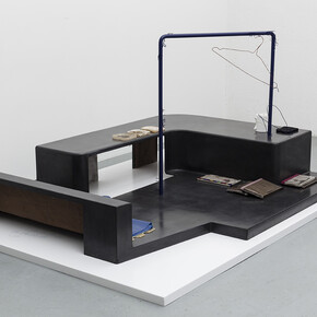 Magali Reus, In Place Of (Sundries), 2015. Black waxed and clear waxed Jesmonite, black waxed polyester resin, silicone rubber, polyurethane rubber, latex, powder coated laser cut steel, phosphated and powder coated steel, steel rod, magnets, sanded paper, polyurethane plastic, fabric, air brushed polyester resin, polyurethane resin, putty wax, vinyl. Part 1: 141 x 188 x 90 cm 