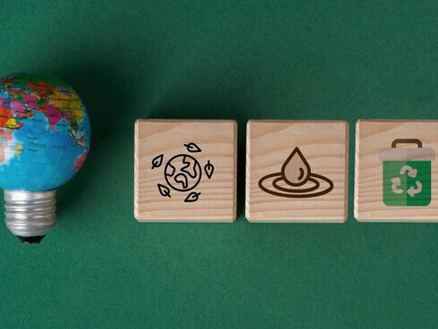 From recycling to renewable energy, these simple wooden symbols represent the complex, interconnected strategies driving green transformation in global industries