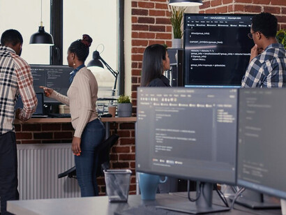 IT professionals collaborate on cutting-edge computing systems, working together to unlock the potential of this transformative technology