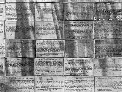 David Goldblatt, Detail of a memorial to children "We are still here", consisting of copies of advertisements that appeared in the Cape Government Gazette, Longmarket pedestrian mall, Cape Town, 11 March 2012. Silver gelatin photograph on fiber-based paper. Image: 86 x 110 cm. Frame: 94 x 118 cm. Courtesy the artist and Marian Goodman Gallery Paris
