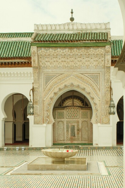 The entrance and courtyard fountain of Al Quaraouiyine University, Fez, Morocco, representing over twelve centuries of Islamic scholarship and architectural excellence