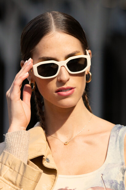 A model wearing statement Versace sunglasses and contemporary styling, representing the brand’s vision of luxury and self-confidence