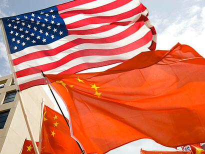 The flags of the United States and China stand over the White House, highlighting the intricate web of diplomatic sanctions and embargoes that define their bilateral ties