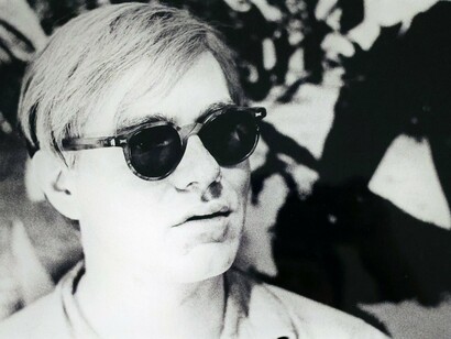 Andy Warhol Posing in Front of “Birmingham Race Riot” (detail). Image copyright William John Kennedy. Courtesy of Woodbury House 