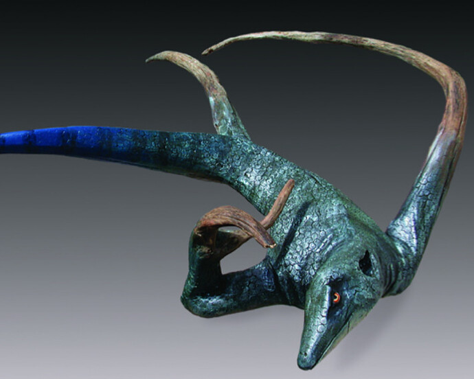 Blue Tail" by Bernie Houston, Carved driftwood with hand punched skin, acrylics and metallic paints, 39" x 27" x 7". 