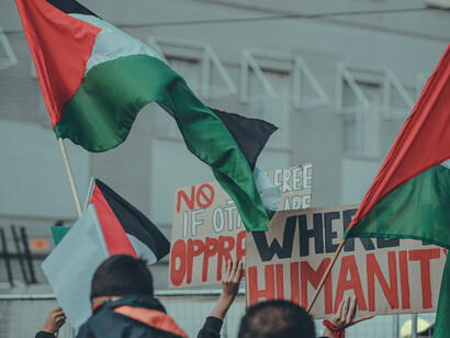 Palestinian flags waving at a demonstration