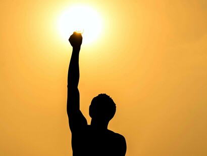 A former slave no longer chained and stretching his hand out in freedom