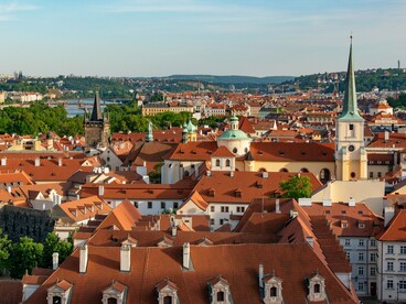 A view of Prague’s red rooftops, historic buildings, bridges, and the Vltava River, representing the city’s mix of history, architecture, and hidden wonders