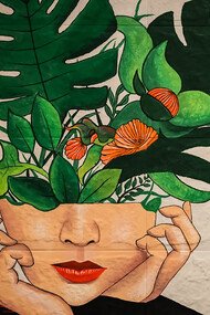 A painting of a girl with green and red flowers emerging from her head, symbolizing the concept of love as a force for personal growth and mental health